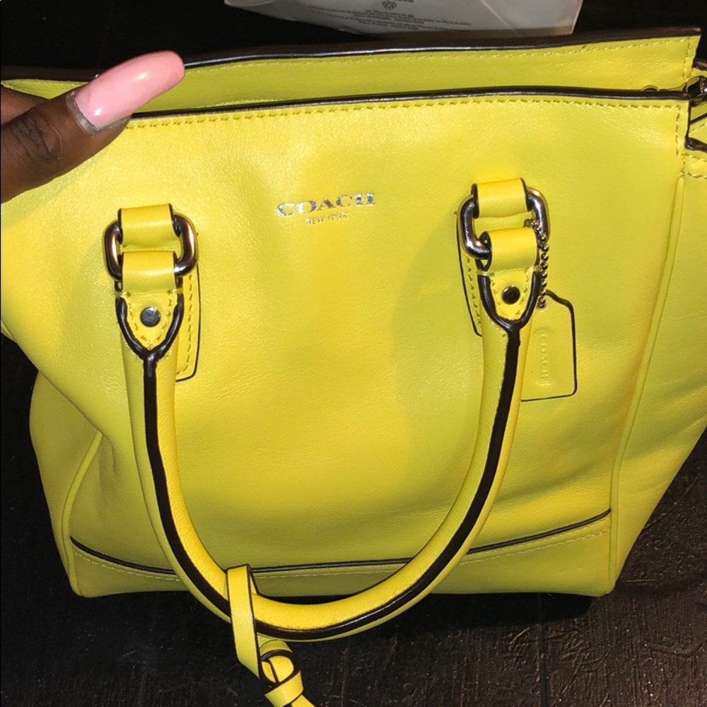 Bright yellow leather coach handbag